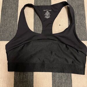 Bandier Black Sports Bra featuring a cut out